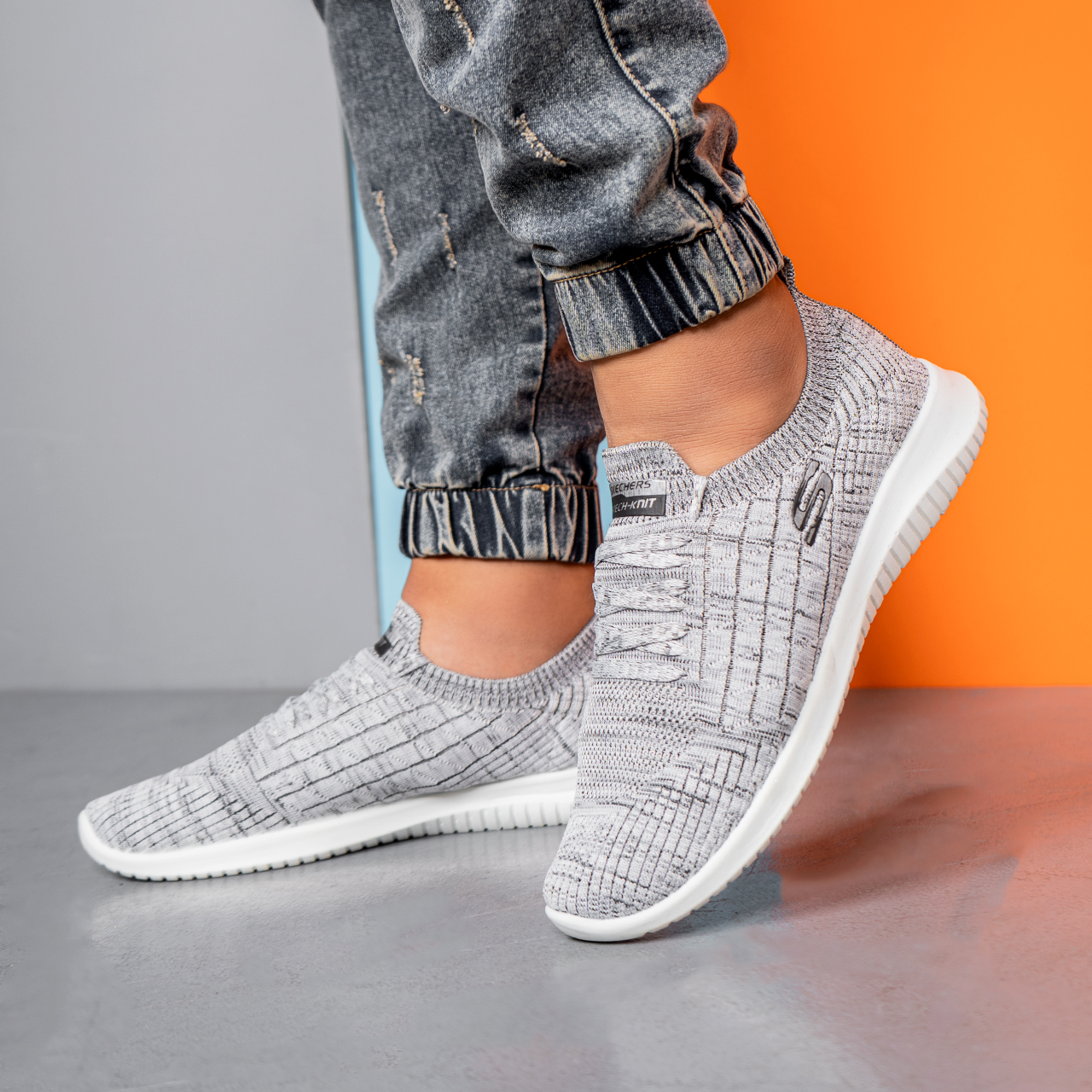 کفش ورزشی اسکیچرز مردانه طوسی طرحدار مدلE55